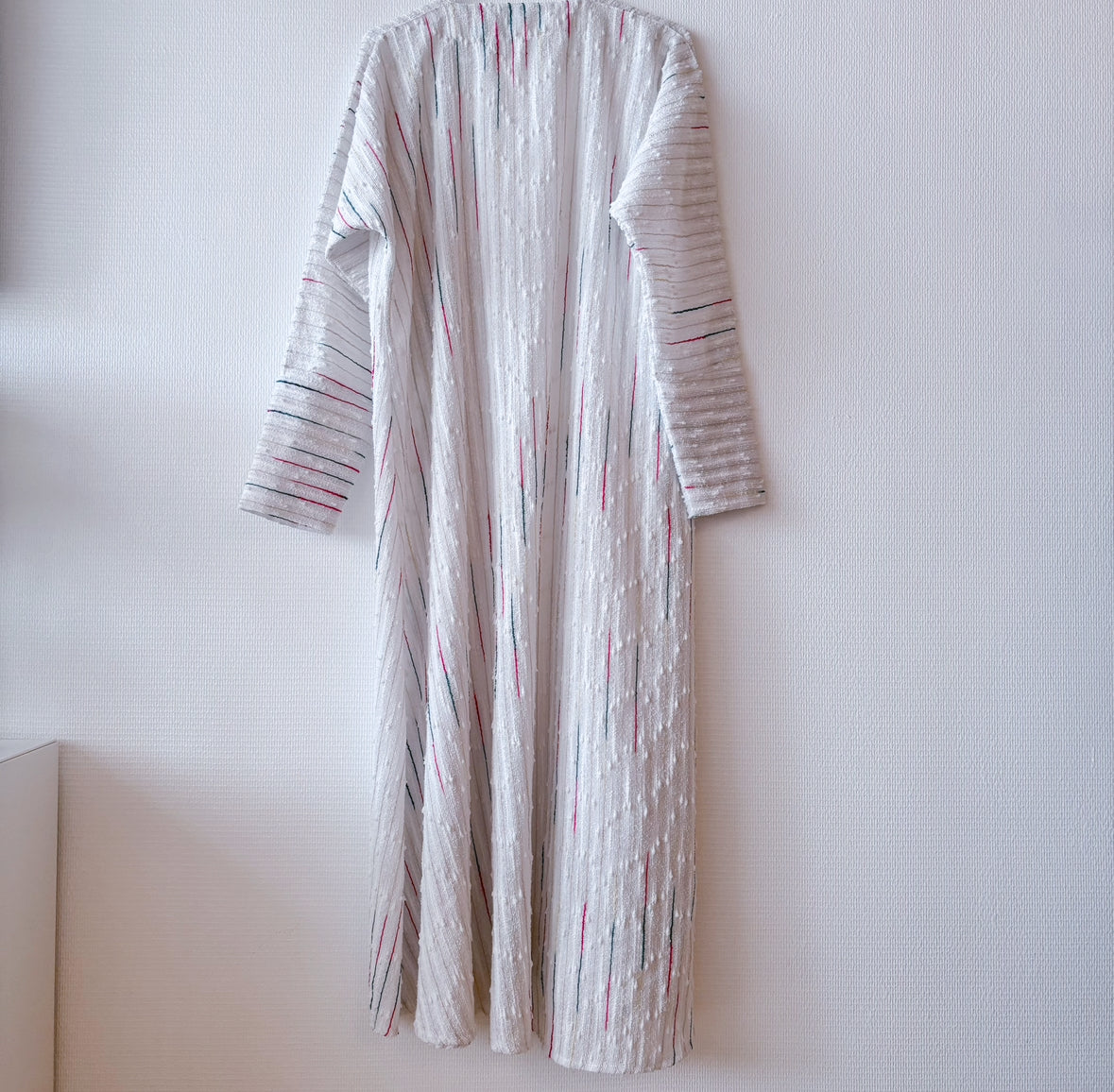 Back view of secondhand white robe