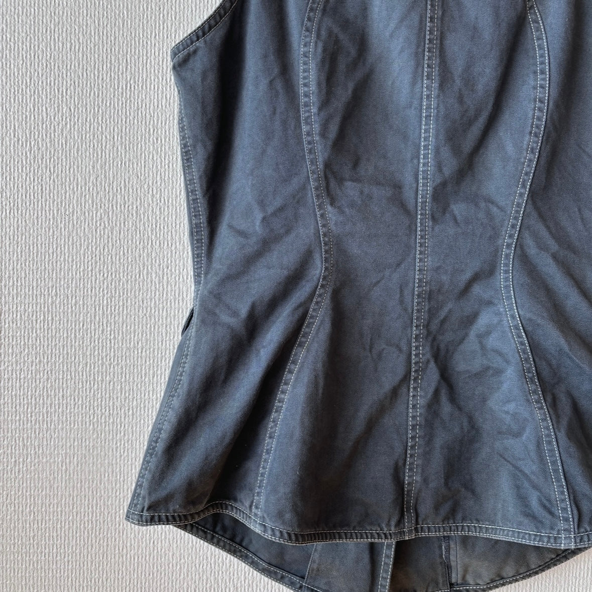 Detailed view of the back on the Thierry Mugler ACTIV Label Vest, highlighting structure and stitching.
