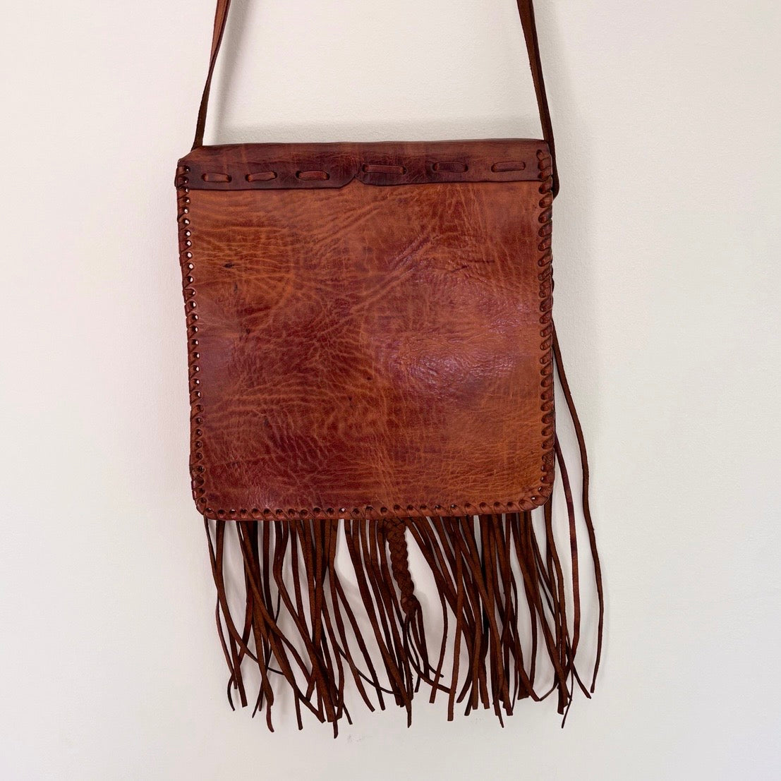 Leather bag with tassels