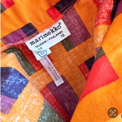 close up of the label Marimekko on the vintage dress