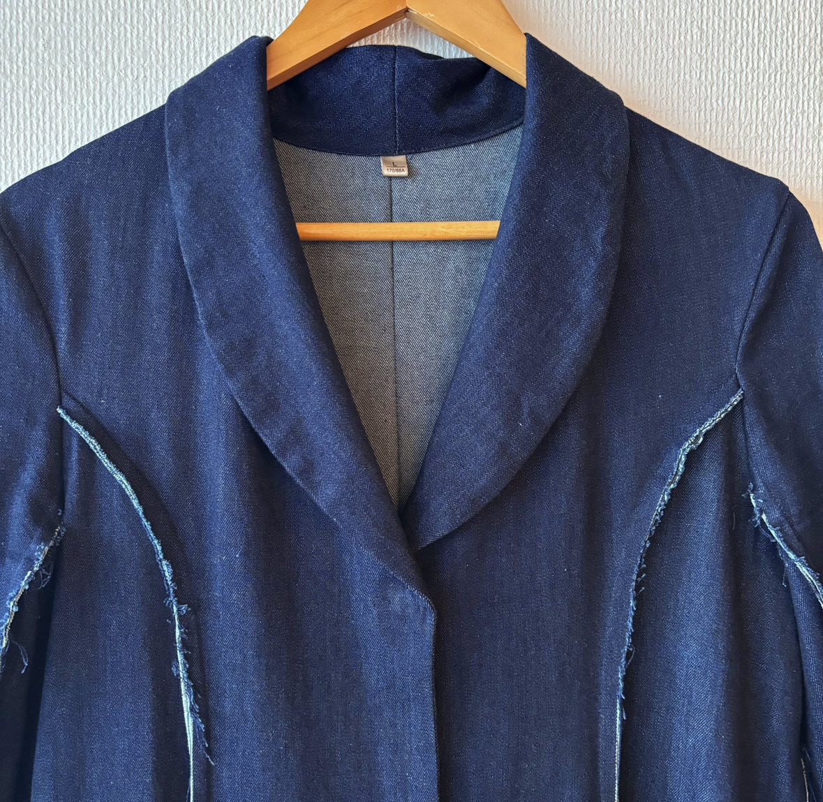 Close-up of collar on dark blue denim coat