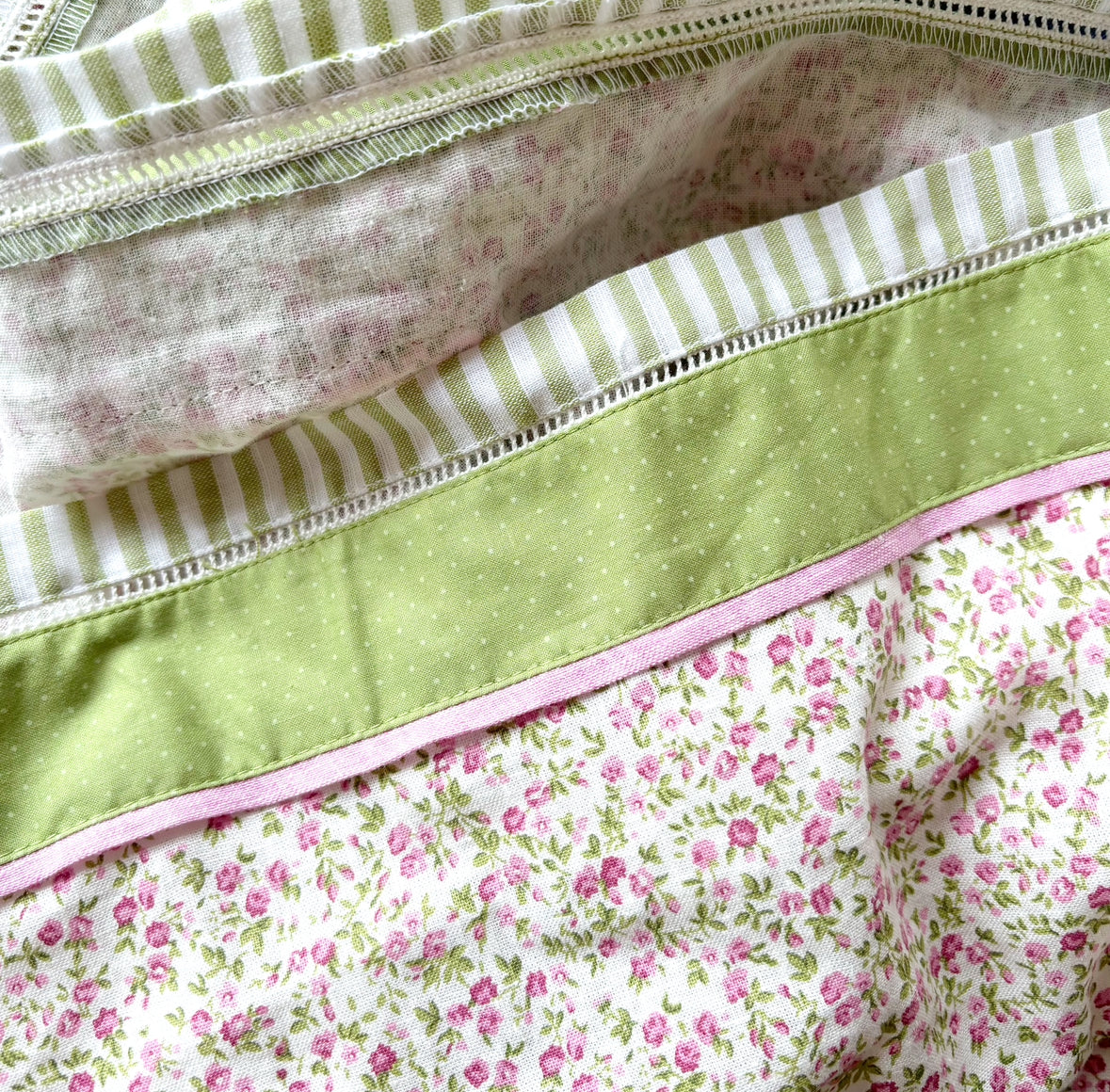 close-up of green border at the hem on floral folkcore dress