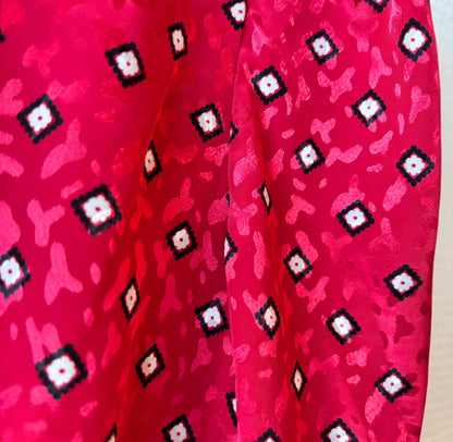 Close-up of the pattern on the retro red dress