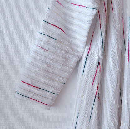 Detail of the sleeve of secondhand white robe