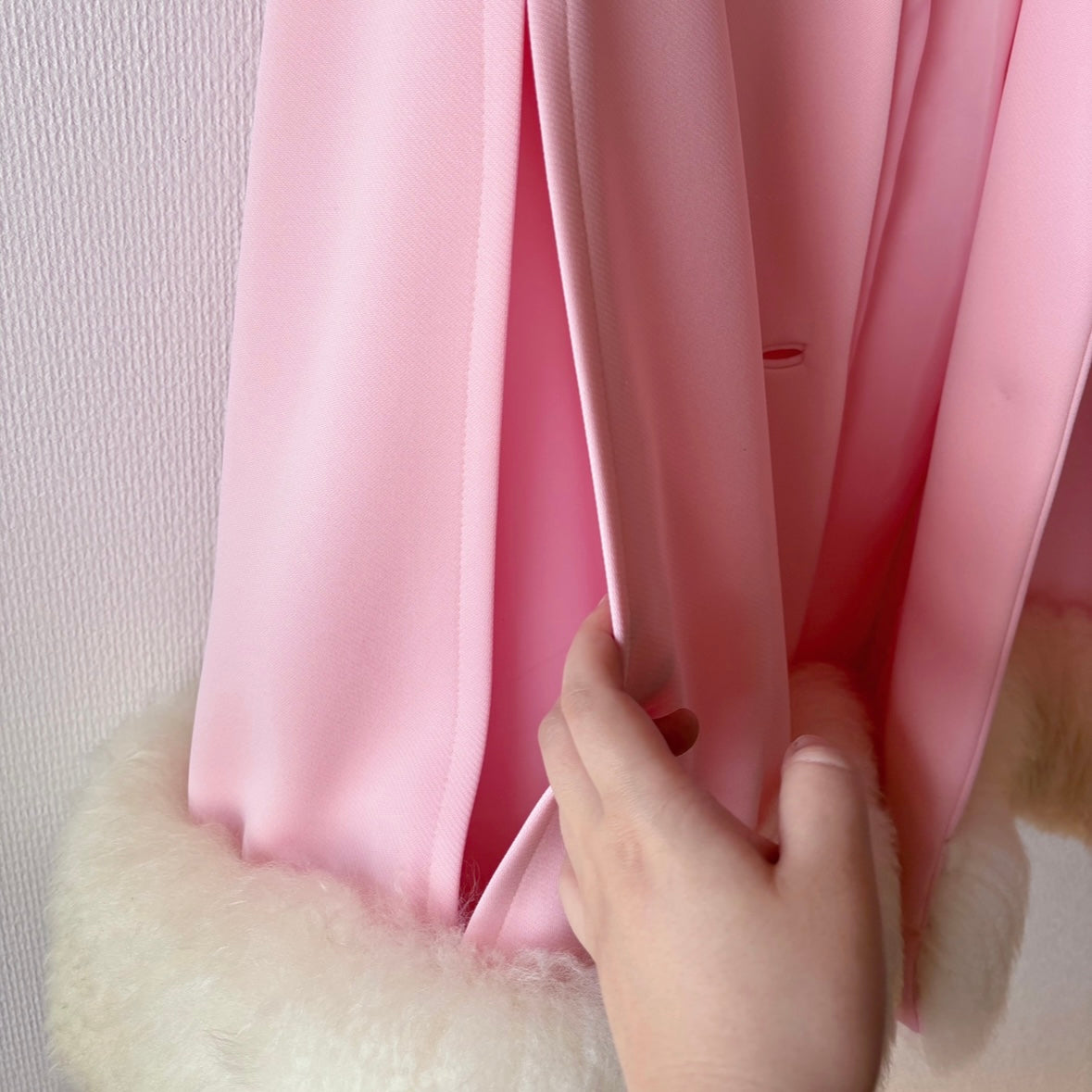 Close-up of intentional side opening on Lilli Ann Pastel Pink Fur Vintage Cape, designed for arm placement