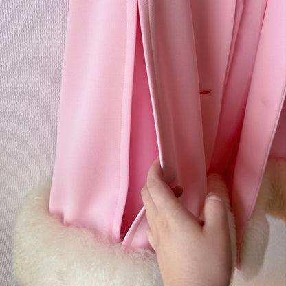 Close-up of intentional side opening on Lilli Ann Pastel Pink Fur Vintage Cape, designed for arm placement
