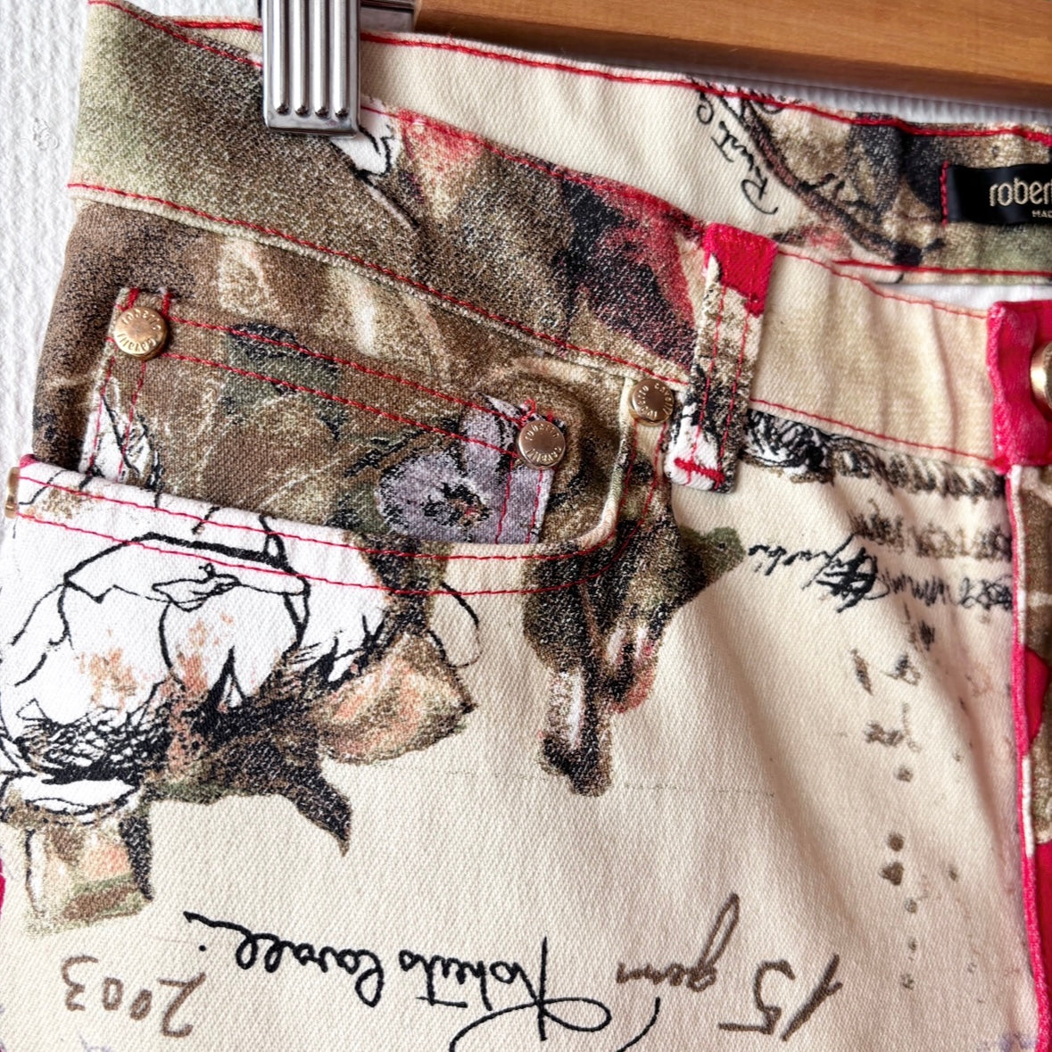 Close up of design on front pocket of Roberto Cavalli Y2K Low-Waist Jeans