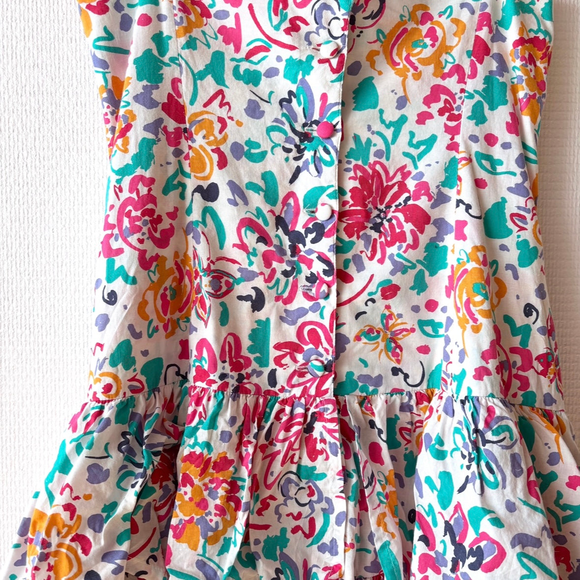 Close-up of floral print on the soft white cotton fabric of the Vintage Laura Ashley Layered Dress