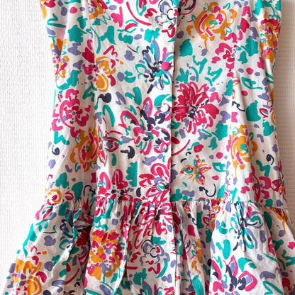 Close-up of floral print on the soft white cotton fabric of the Vintage Laura Ashley Layered Dress